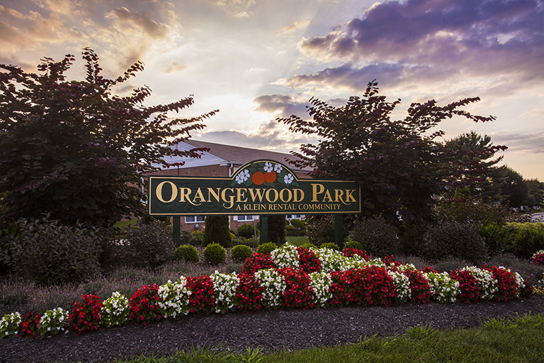 Entrance sign to Orangewood Park Apartments in Levittown